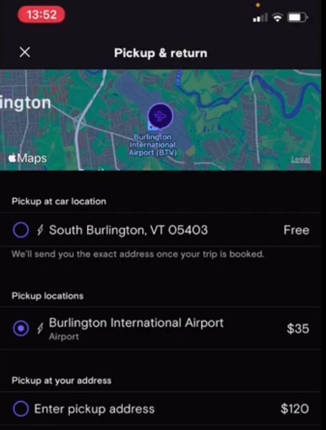 Pickup and return screen: pickup at the car’s South Burlington location is free, Burlington International Airport costs $35, a custom address costs $120